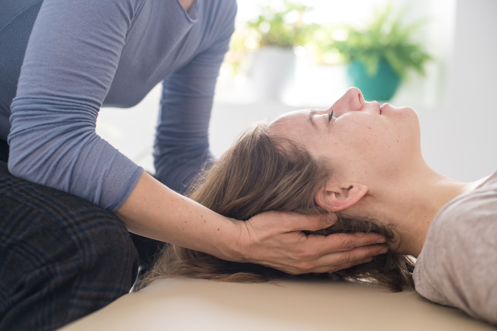 Woman practicing Somatic movement in her Health Studio, Awareness through movement, embodiment and Feldenkrais Method